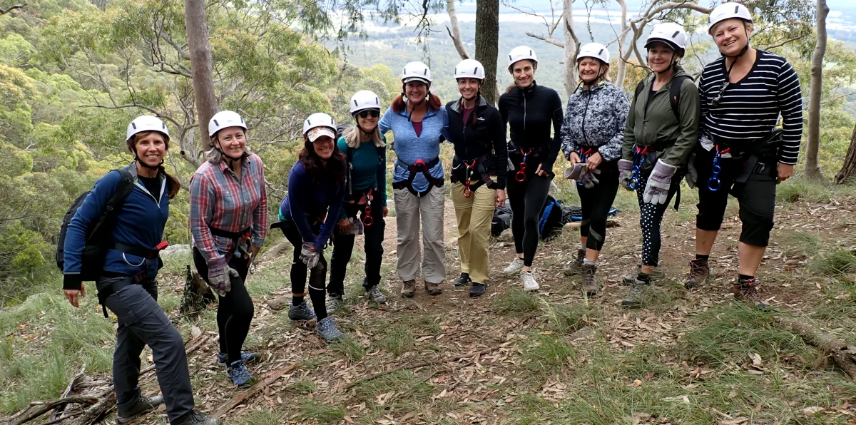 Group of people are standing in a line ready to go abseiling on the Hunter Valley Abseiling Adventure