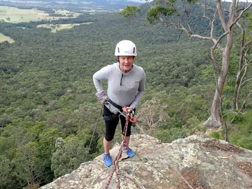 A person is standing ready to abseil on the Lake Macquarie Abseiling Adventure
