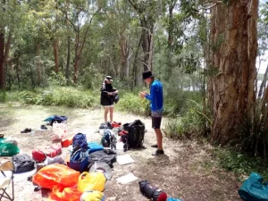 Paddlers are sorting gear before loading the kayaks on the Bronze Kayaking Award Journey