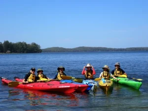 A group of students rafting together on the Pack and Paddle school Camp