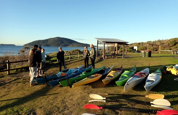 Sea Kayaks Broughton Island Paddle Sea kayakers leaving for Broughton Island during a guided tour from Myall Lakes National Park NSW